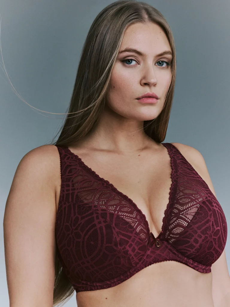 a woman in a burgandy bra