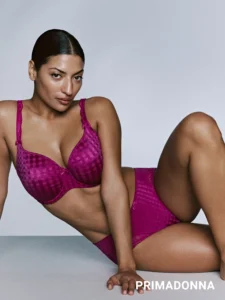 a woman wearing a pink primadonna lingerie set