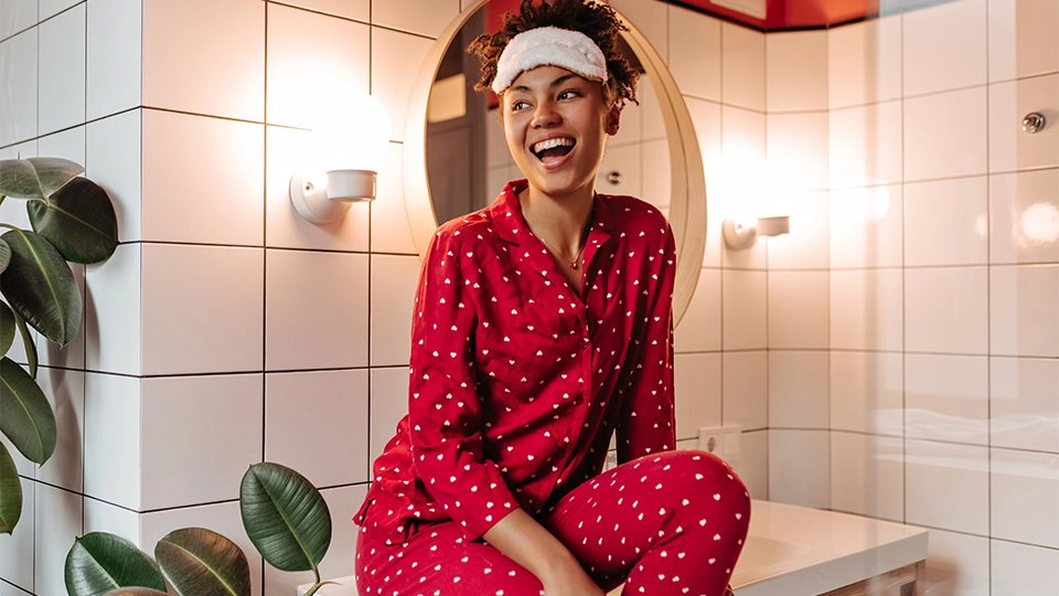 a woman in comfy red pajamas